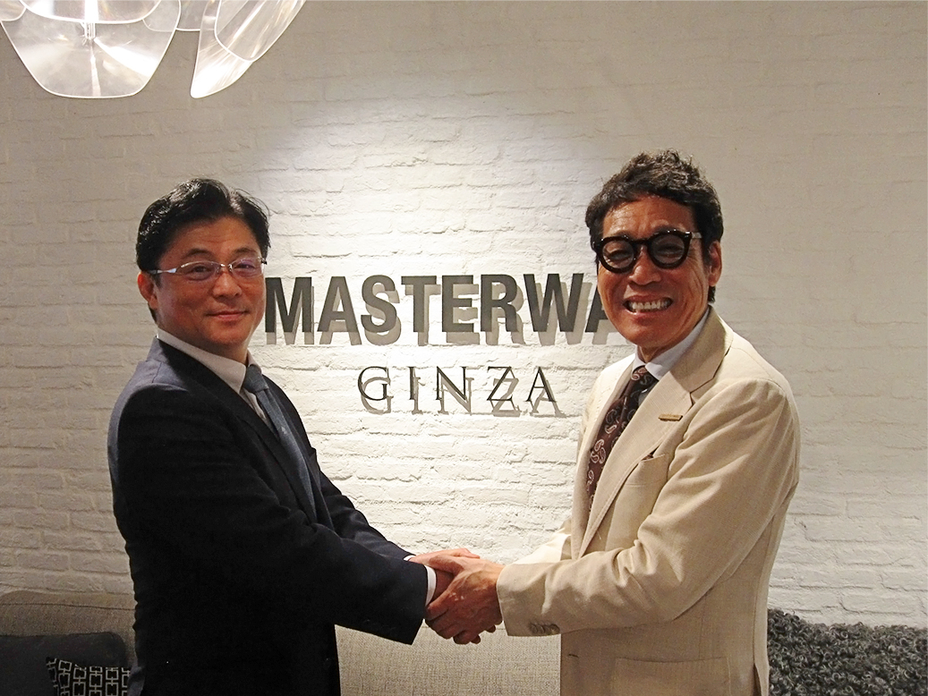 藤井社長と宮島社長の握手